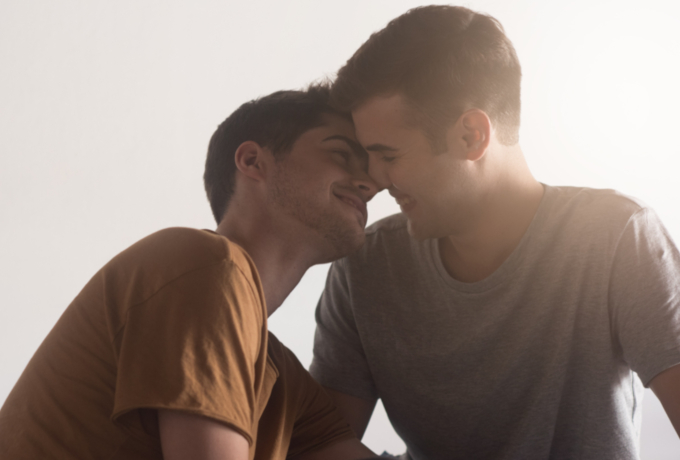Young men embracing being gay